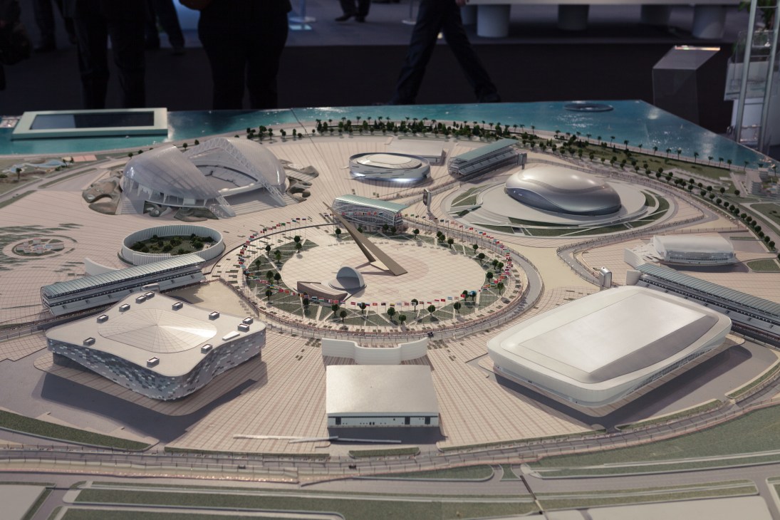 Architectural model of Sochi Olympic Park featuring modernist stadiums and venues surrounding a central plaza with landscaping.