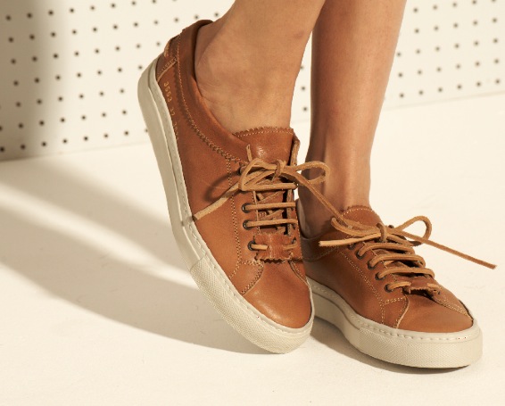 Common Projects women's Achilles Raw nappa leather shoes in tan with white sole and brown laces.