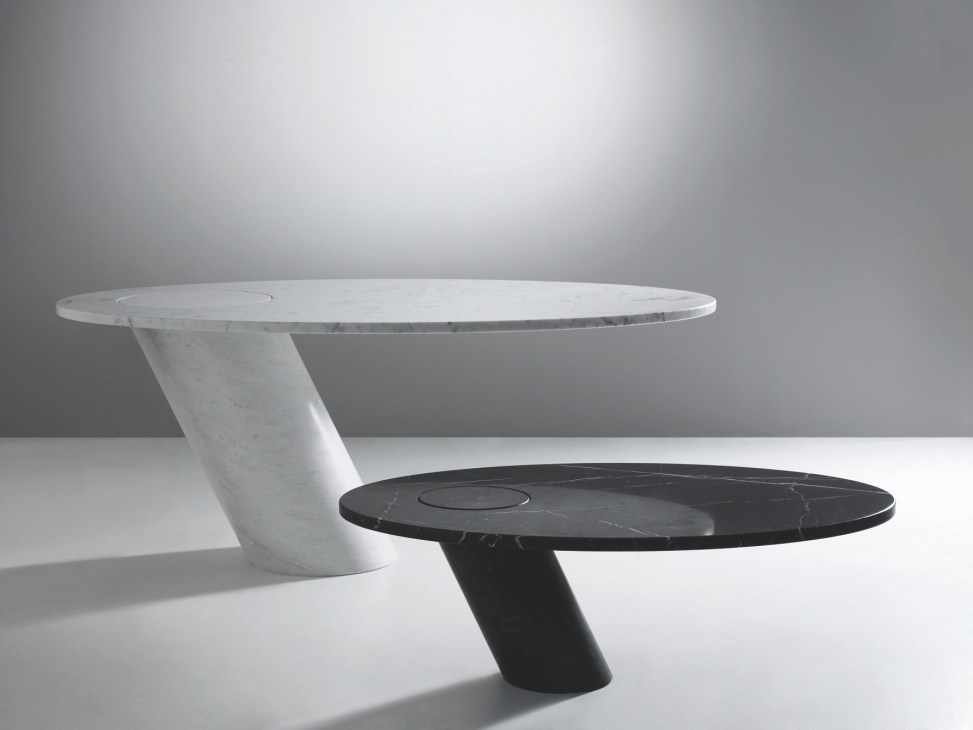 Two modern round tables with sculptural pedestal bases in white and black marble.