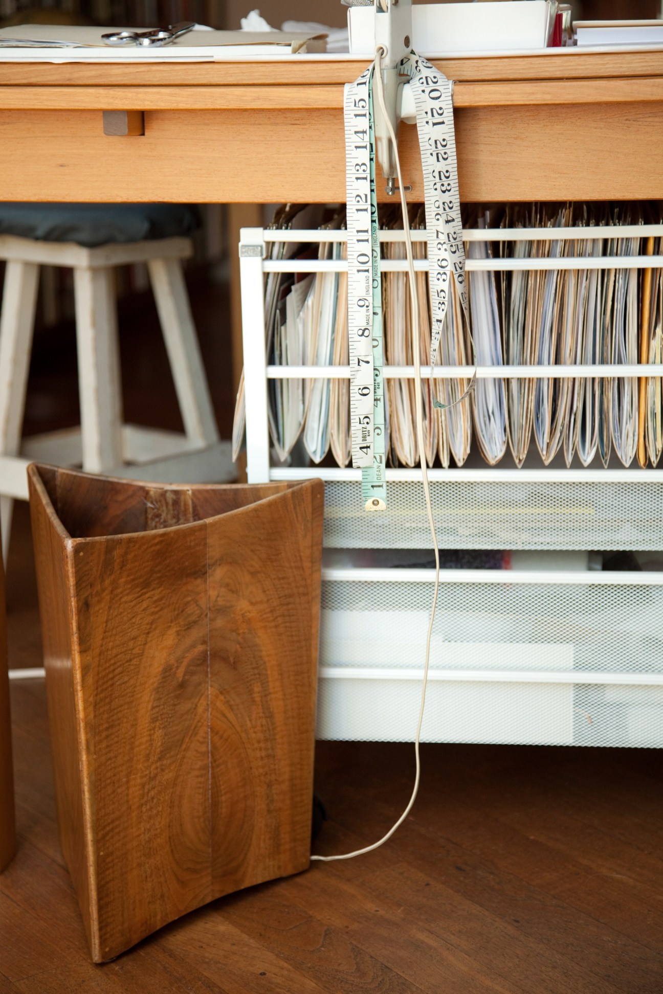 Wooden bin by Bob Stocksdale with woven textile samples and measuring tape.