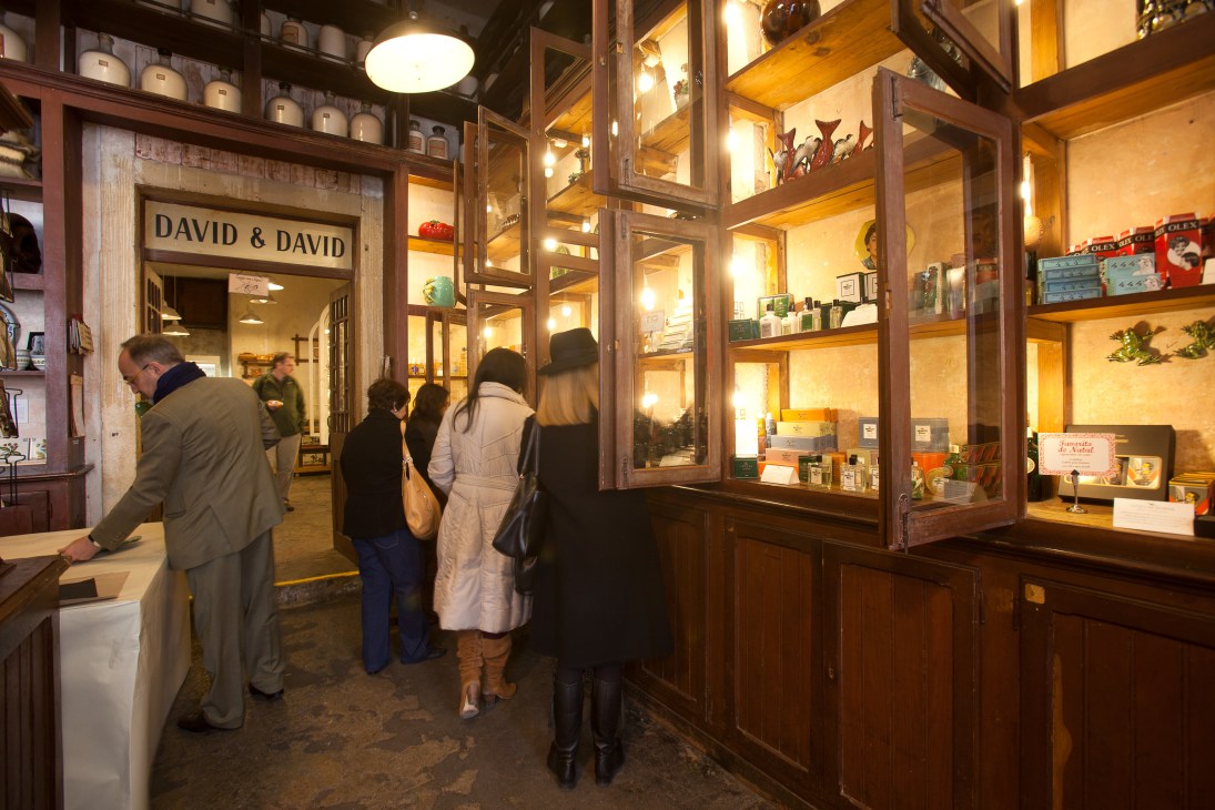 Storefront of A Vida Portuguesa with wooden framing and display windows showing customers inside the shop.