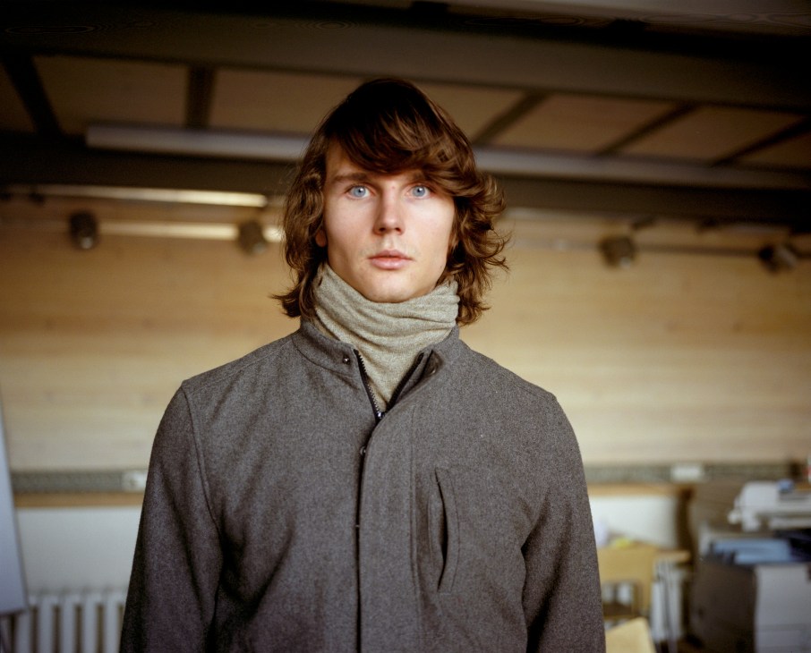 Portrait of Strelka Institute student Ivan Solomin in a studio space.