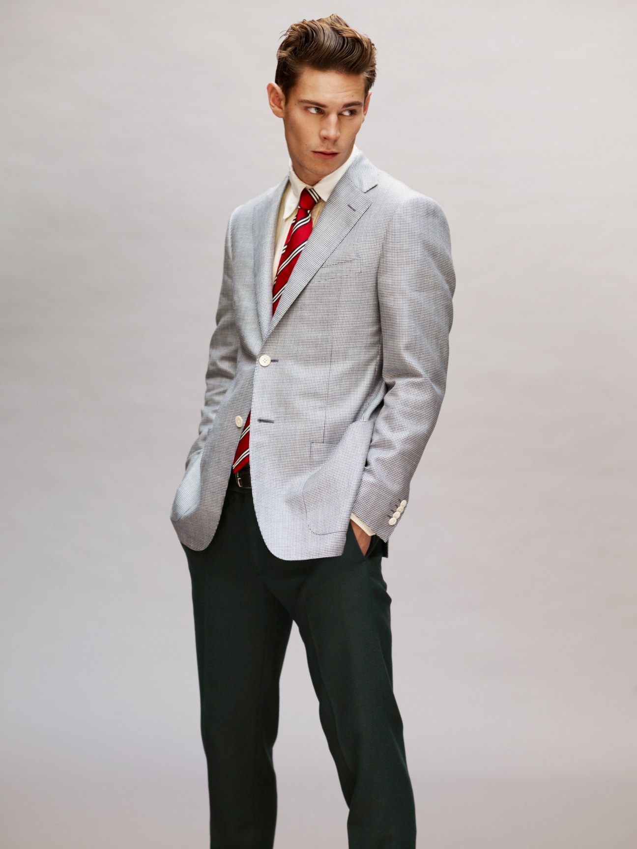 Male model wearing Corneliani jacket with Gitman Brothers shirt, Hackett tie, Oliver Spencer belt and Piombo trousers.