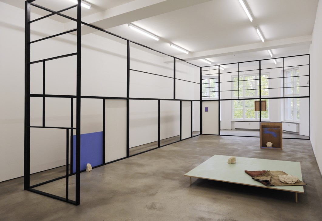 Contemporary art gallery interior displaying Thea Djordjadze's exhibition with geometric black grid structures and sculptural objects.