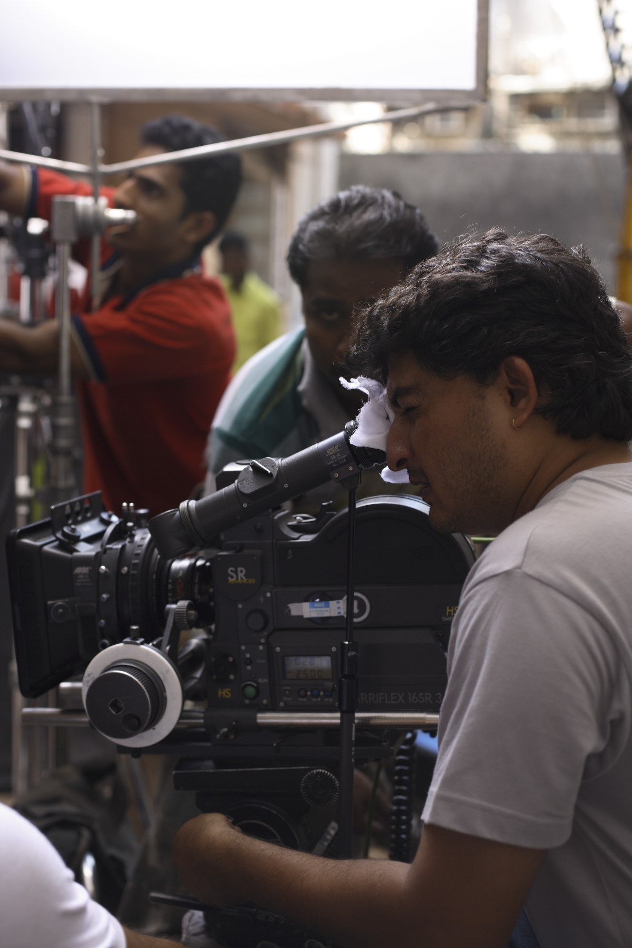 Cinematographer operating a professional camera on the set of a Tide detergent TV commercial in Mumbai.