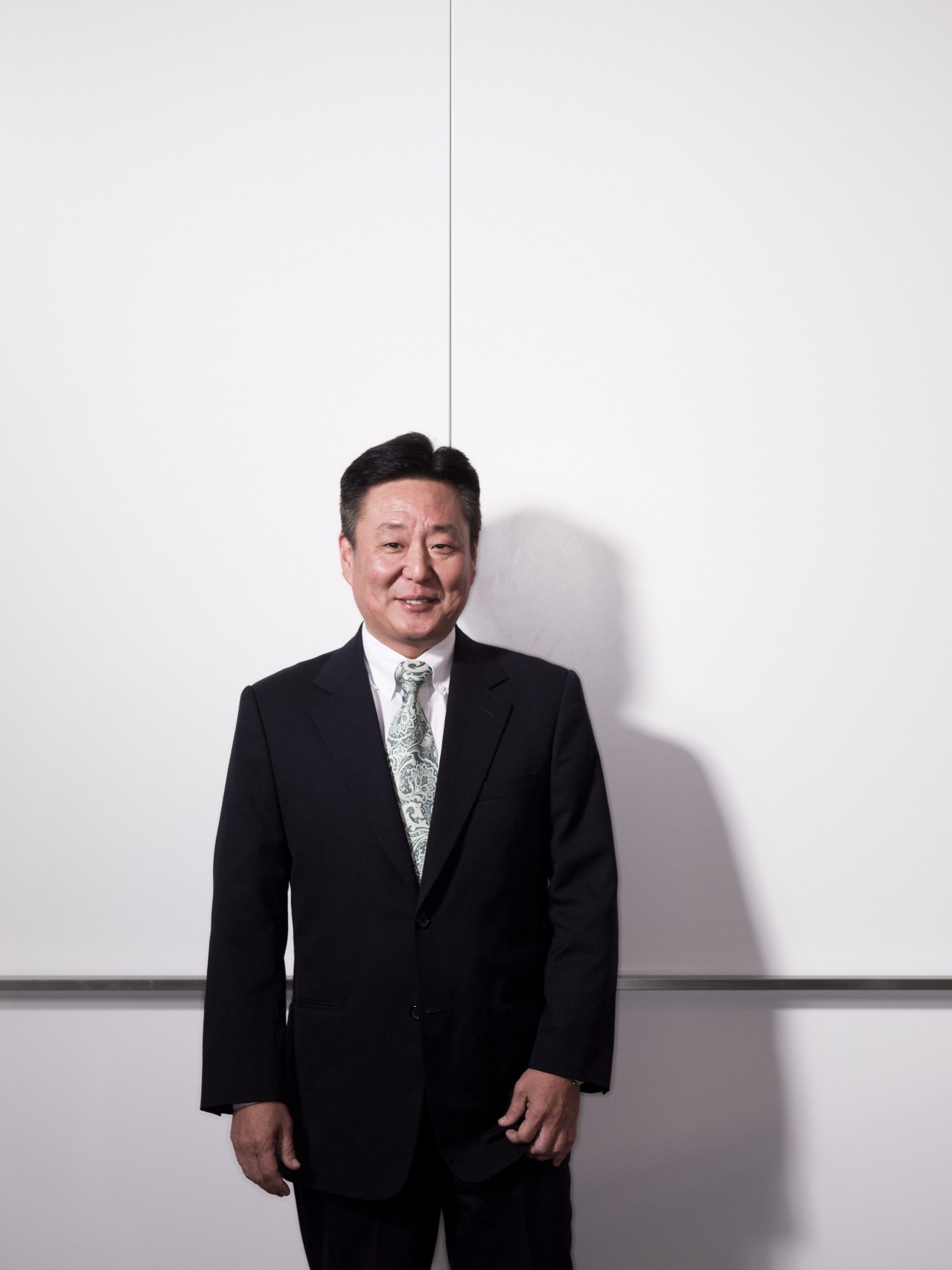Mark Hong, vice president at CB Richard Ellis, wearing a dark suit and patterned tie against a white background.