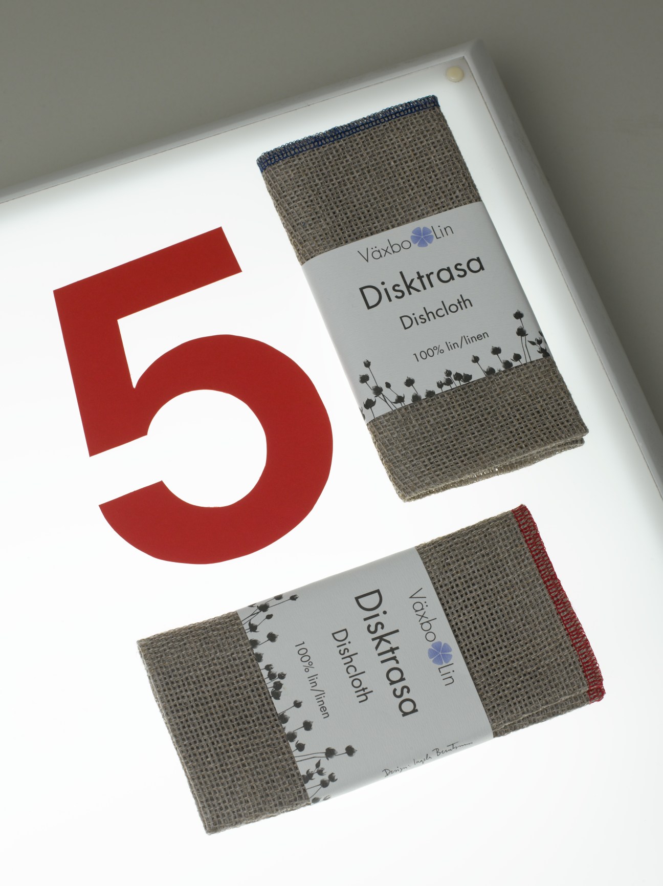 Växbo Lin linen dishcloths with branded packaging showing 100% linen content and floral design details.