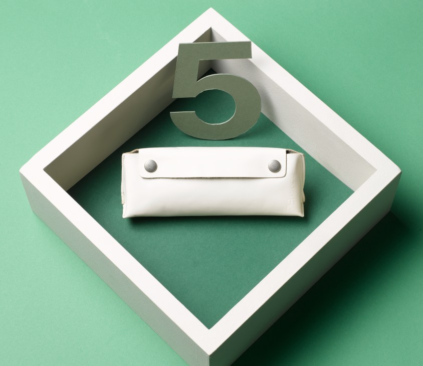 MH Way white leather pencil case with metal studs in geometric framed display