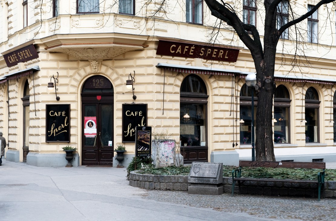 Café Sperl storefront with cream-coloured facade, dark signage and arched windows on Gumpendorferstrasse in Vienna.