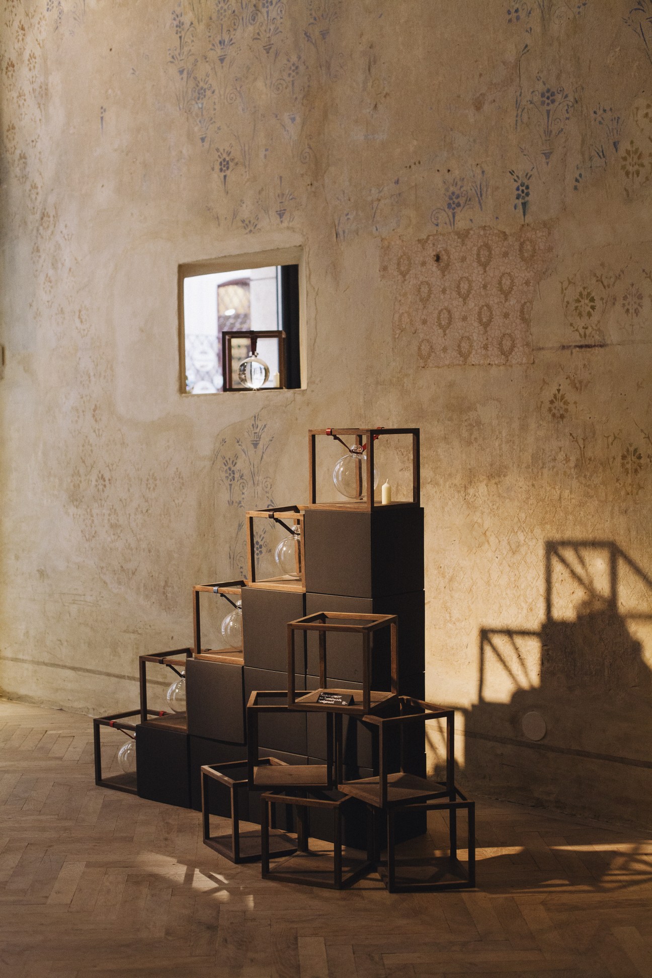 Display of handcrafted leather goods and accessories in wooden frames at Rudolf Scheer & Söhne's Vienna shop.