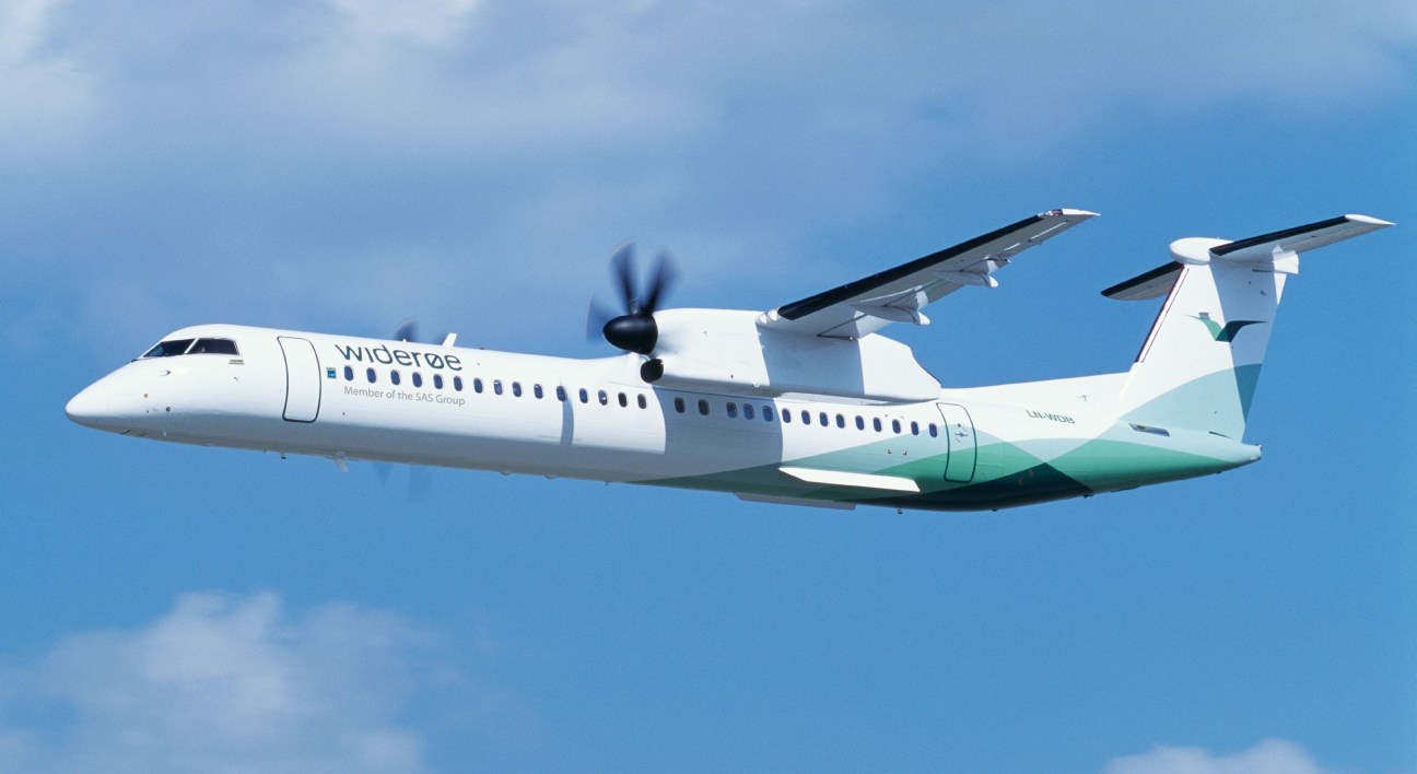 Bombardier Dash-8 Q400 turboprop aircraft in flight against blue sky