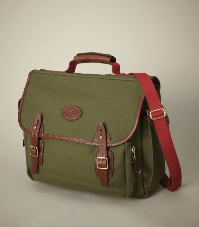 Chapman Airborne bag in olive canvas with brown leather straps and red shoulder strap.