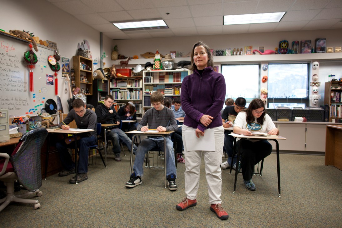 English teacher Shawna Rudio standing in a classroom with students seated at desks during a lesson.
