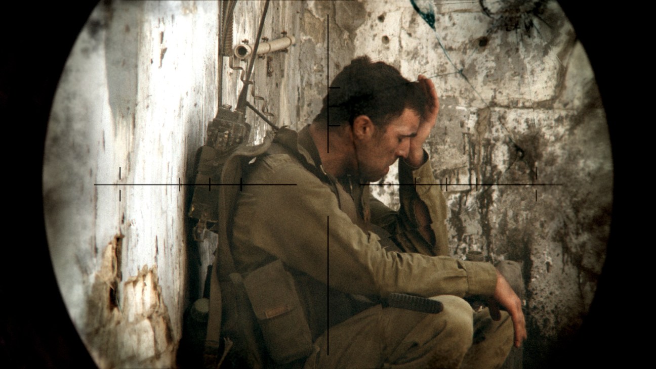 Israeli soldier viewed through tank periscope in the 1982 Lebanon War film by Samuel Maoz.