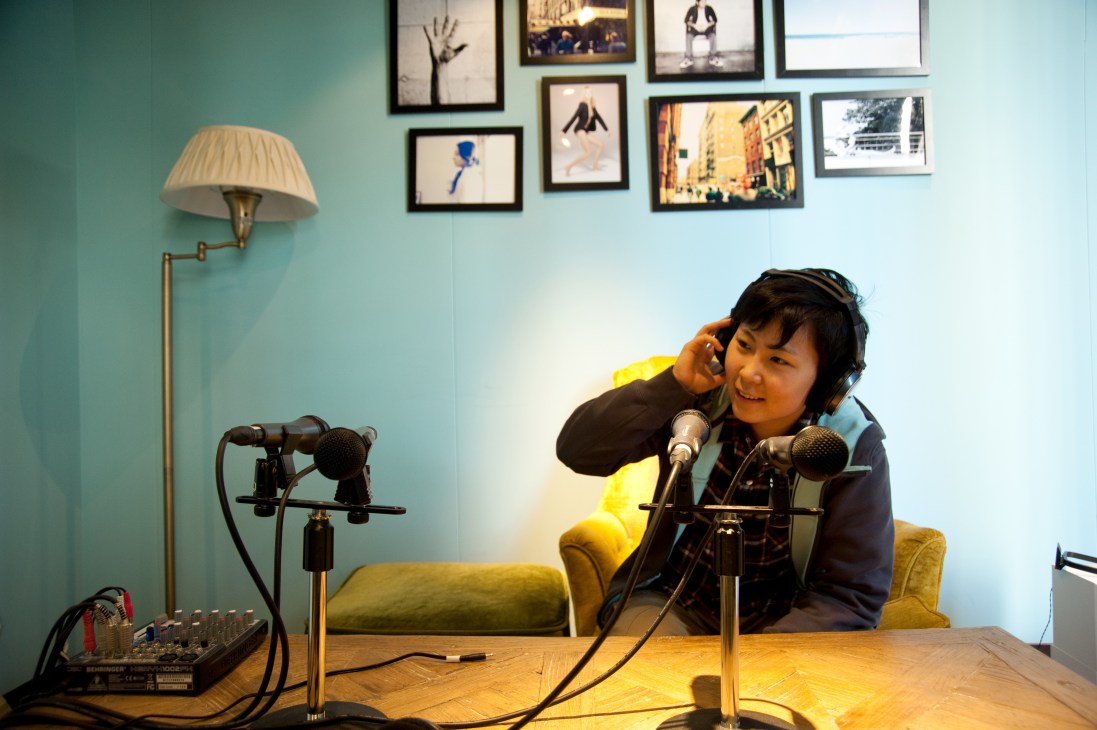Kana Naoi speaks into a microphone at Sora X Niwa FM radio station in The Share building.