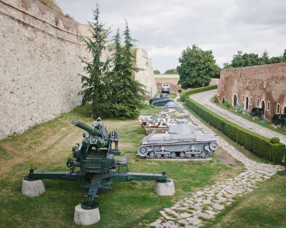 Military weapons and tanks displayed in courtyard at Belgrade's Kalemegdan fortress.