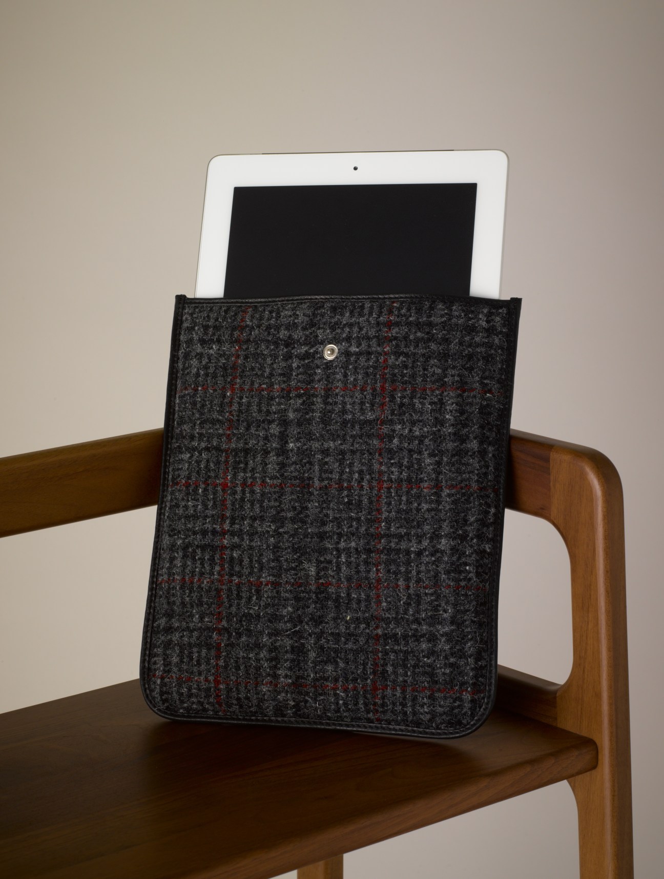 iPad in Simon Carter Harris tweed case on wooden chair