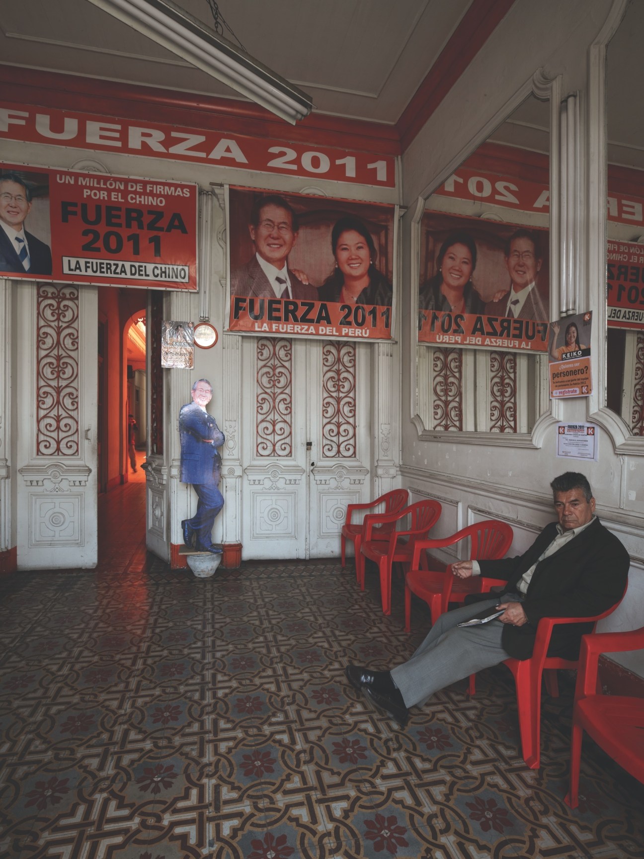 Foyer of Fuerza 2011 campaign headquarters with red banners and family photos