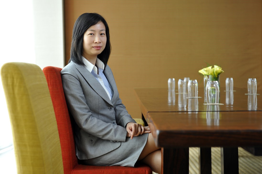 Fanny Vong of the Macau Institute for Tourism Studies sitting at a conference table.