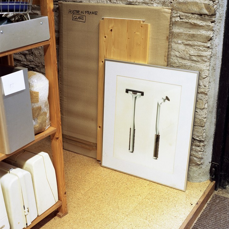 Framed display showing two Wilkinson Royale razor designs mounted on white background in Kenneth Grange's studio archive.