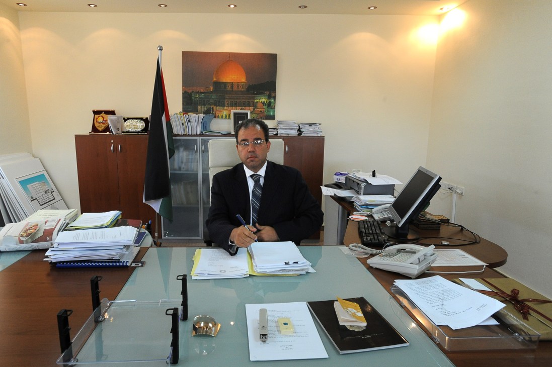 Jihad al-Wazir, governor of the Palestine Monetary Authority, seated at his desk in his Ramallah office.