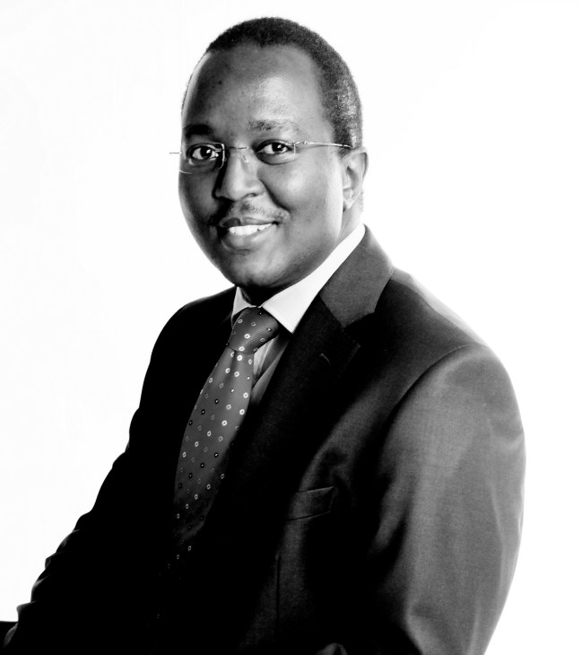 Peter Mwangi, Chief executive of Nairobi Stock Exchange, in professional black and white portrait.