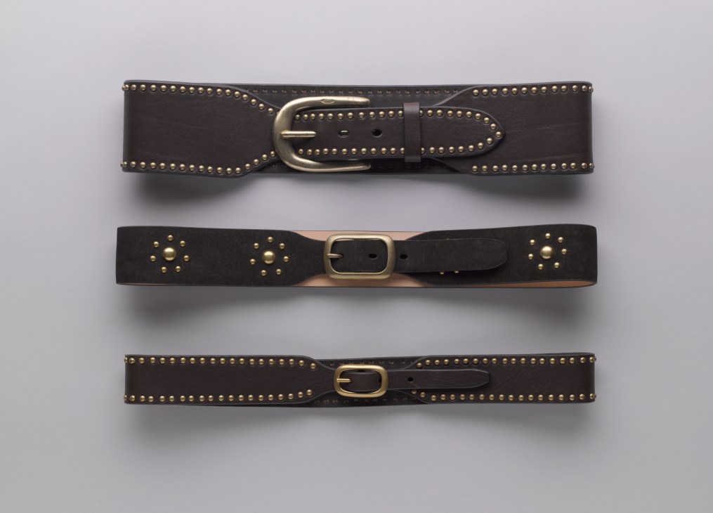 Three leather belts with nickel studs and brass buckles by J&M Davidson.