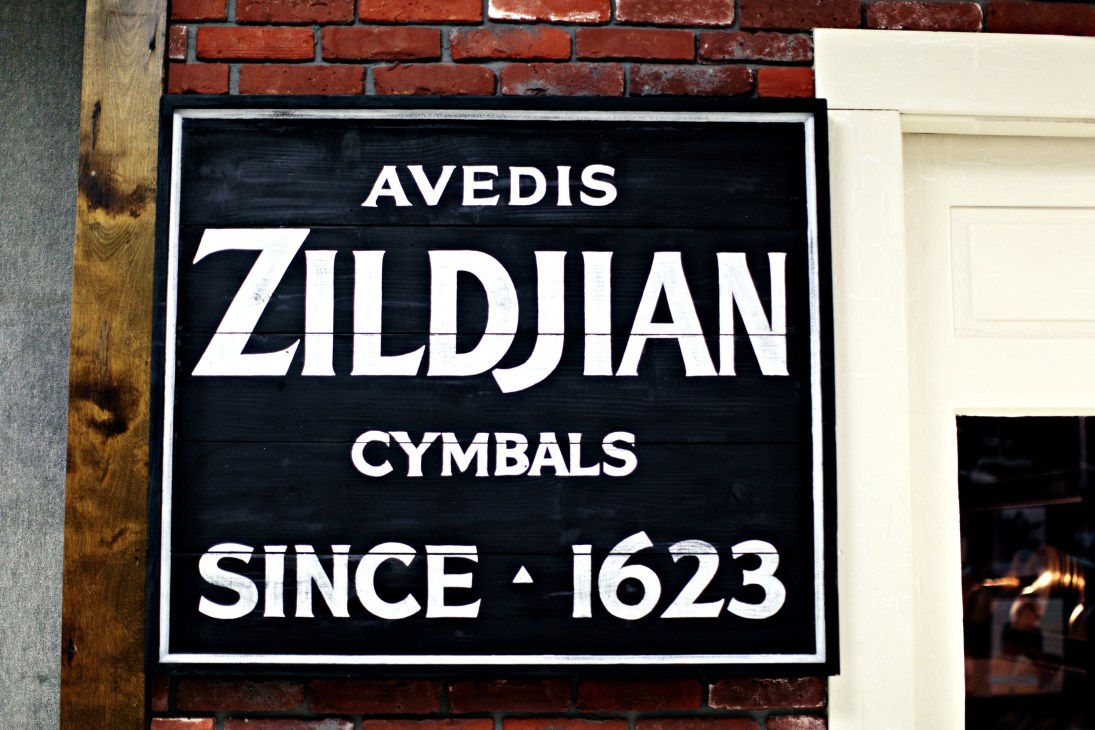 Avedis Zildjian Cymbals sign on brick wall stating 'Since 1623'
