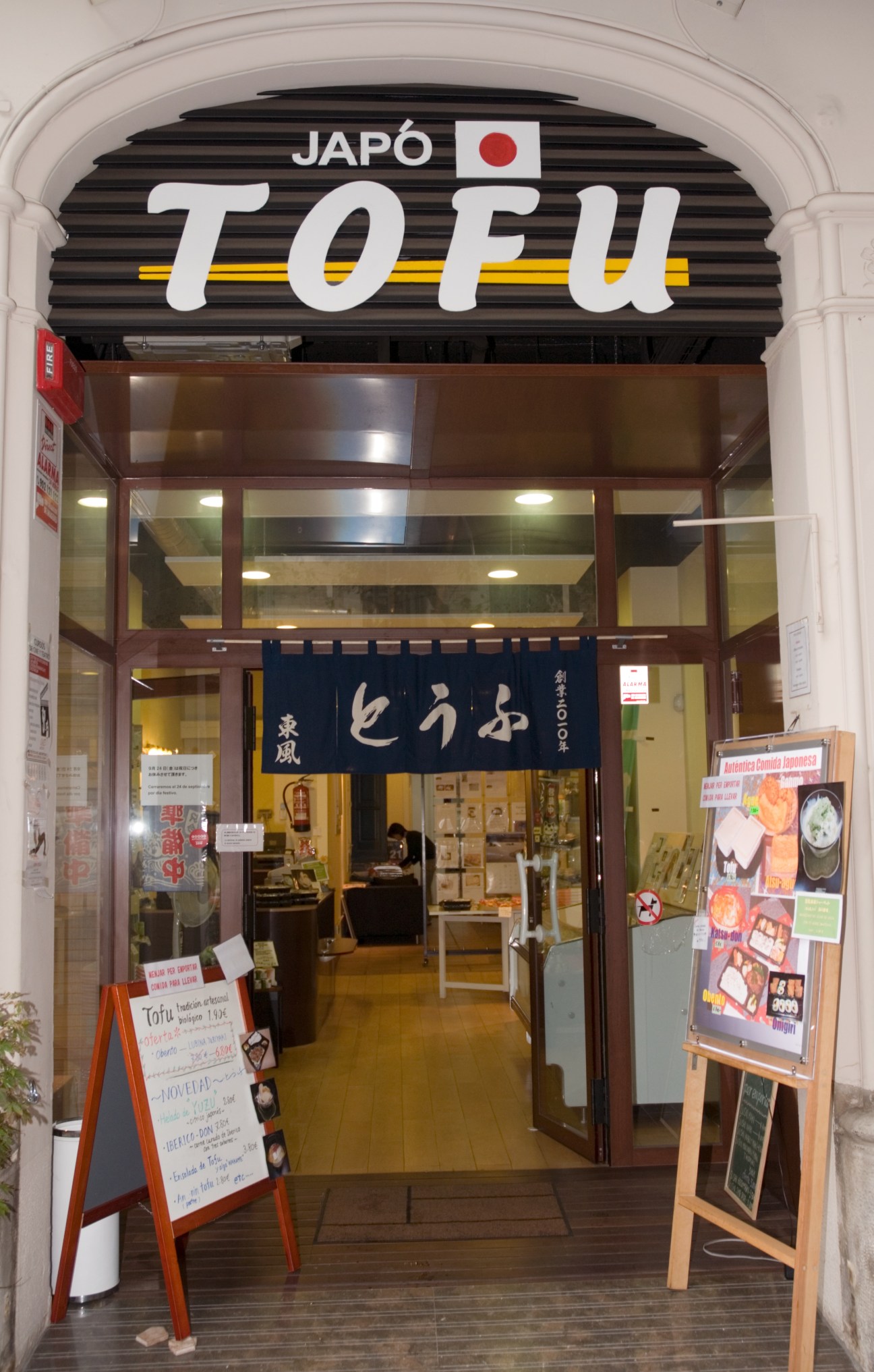 Japó Tofu shop storefront in Barcelona's Eixample neighbourhood with signage and menu boards.