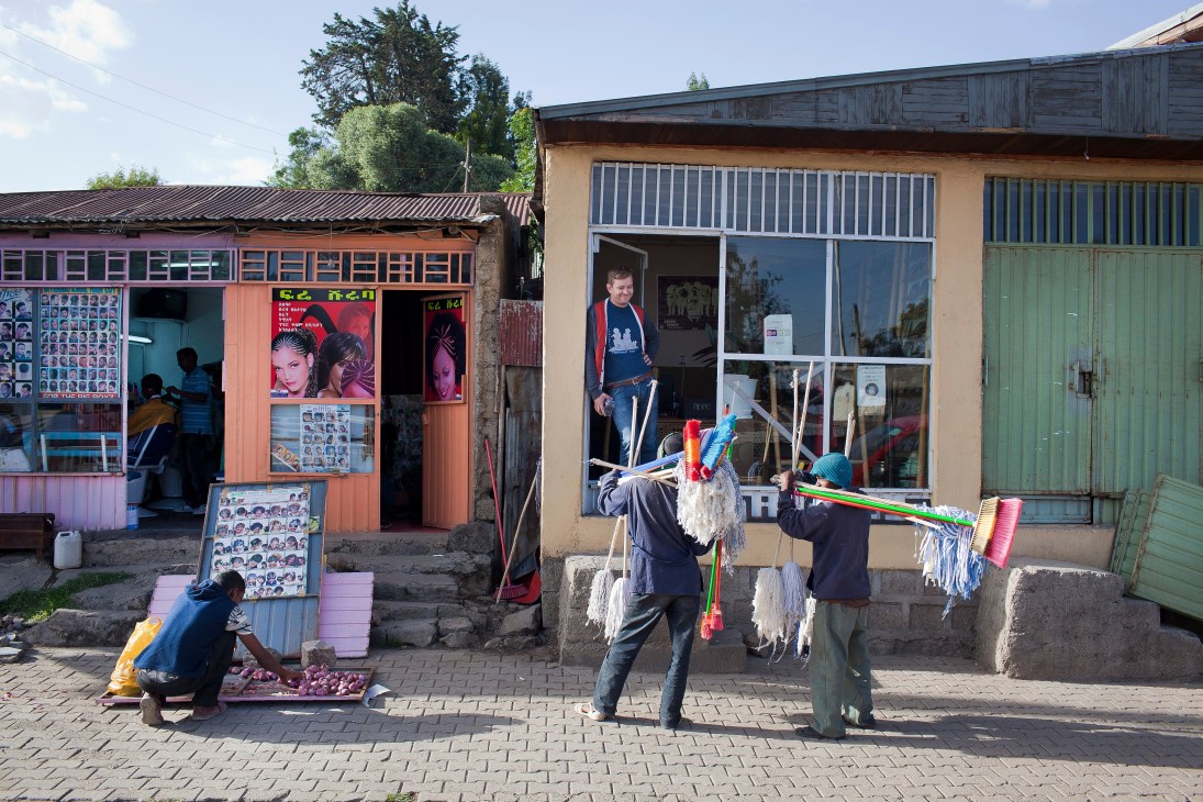 Mitmitta music store storefront in Addis Ababa with colorful displays and customers browsing outside.