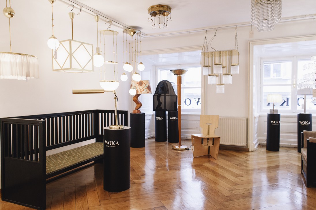 Woka lighting showroom displaying brass and glass pendant lights and chandeliers.