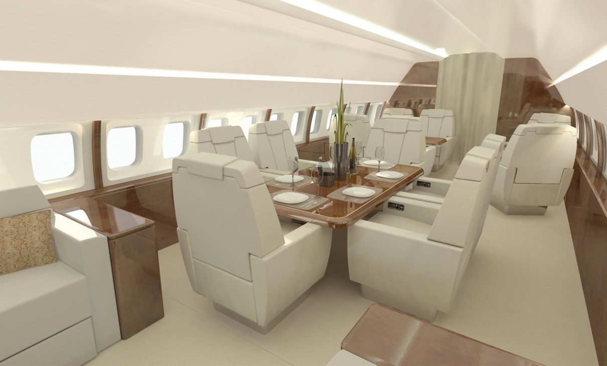 Luxury aircraft interior with cream leather seats, wooden tables, and large windows showing a New Zealand-based Altitude aircraft refit design.