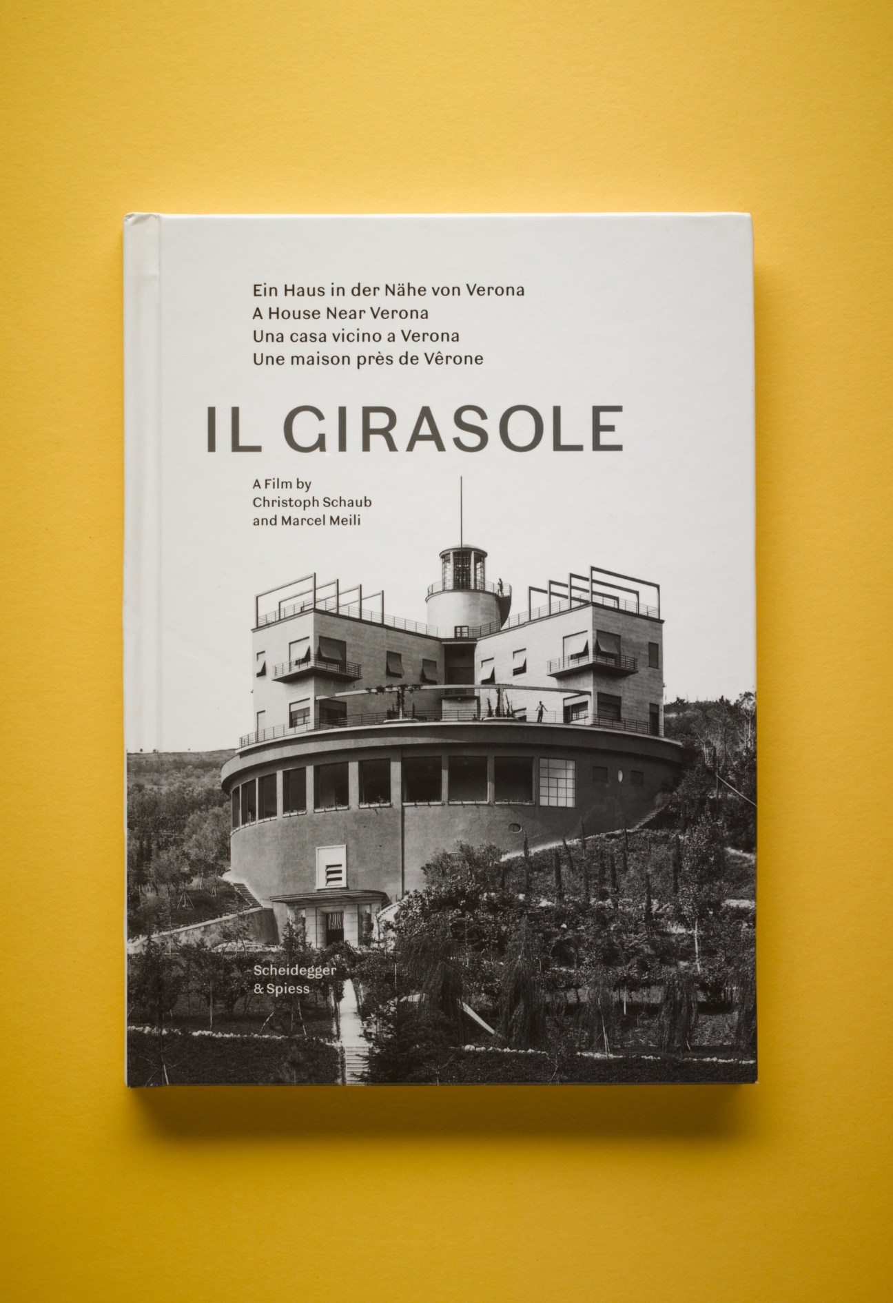 DVD cover of Il Girasole film about a rotating house near Verona, showing the modernist cylindrical villa on yellow background.