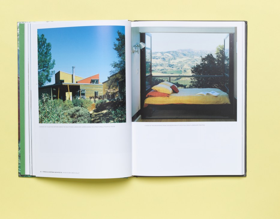 Open book displaying two architectural photographs: a colorful modern house exterior and an interior bedroom with mountain views.