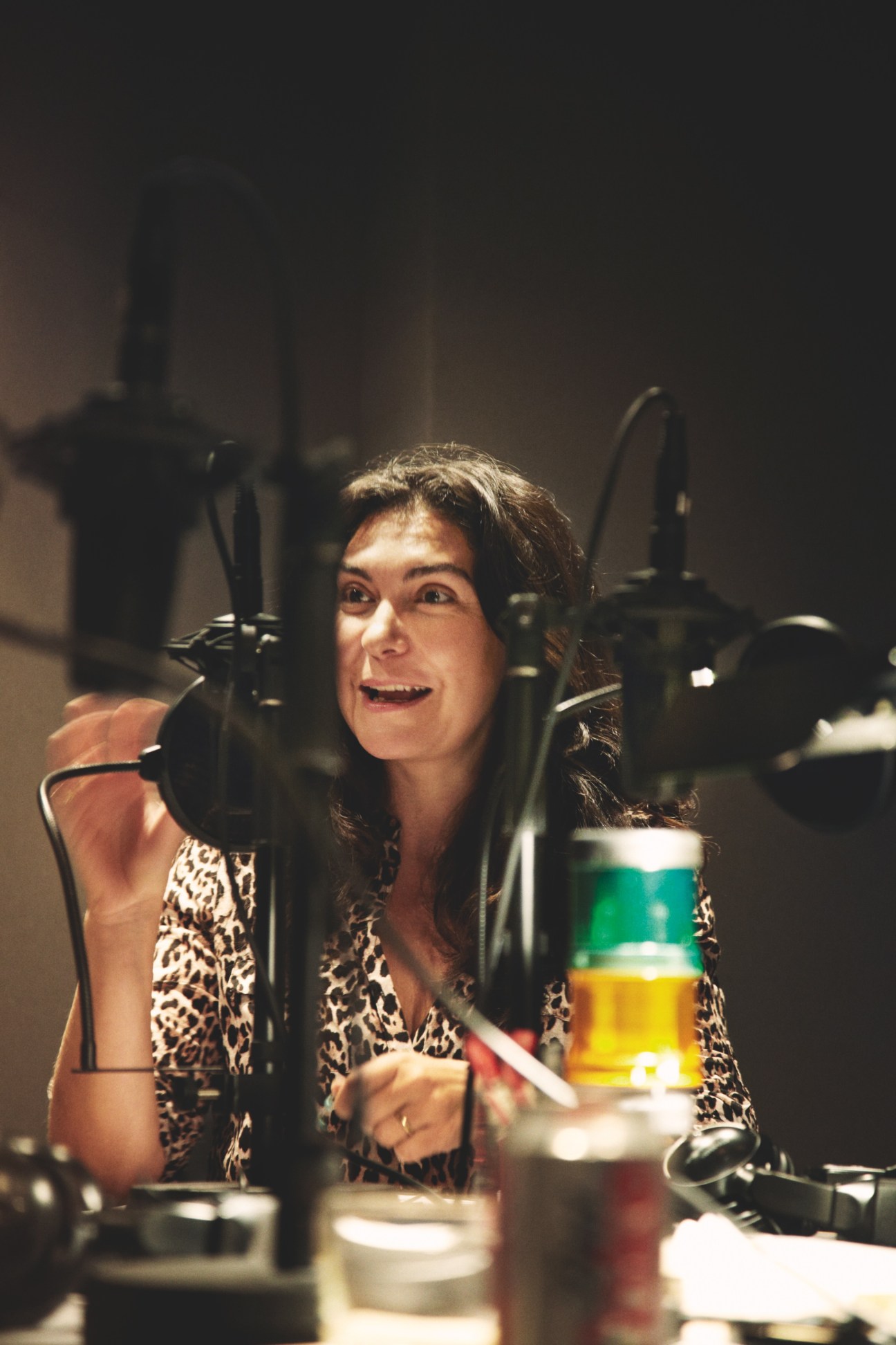 Sagra Maceira de Rosen, a luxury brand expert, speaking into a microphone in a radio studio.