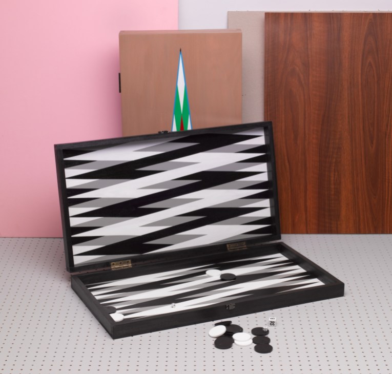 Ara Peterson hand-painted backgammon board with black and white geometric pattern, open with game pieces and dice.