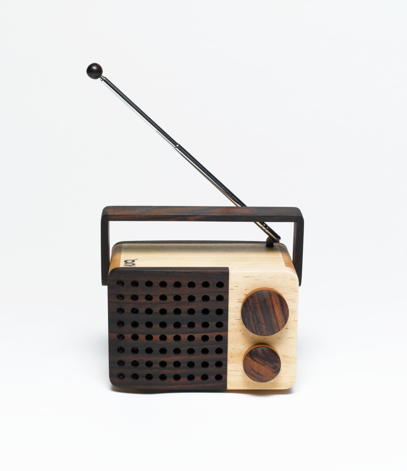 Magno handcrafted wooden radio with dark wood speaker grille, light wood body, two control knobs, and antenna against white background.