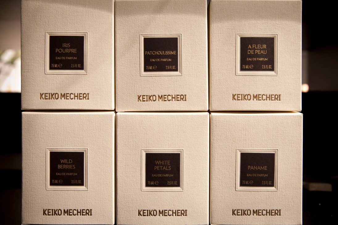 Six cream-colored Keiko Mecheri perfume boxes arranged in two rows, each with a dark label displaying the scent name and volume.