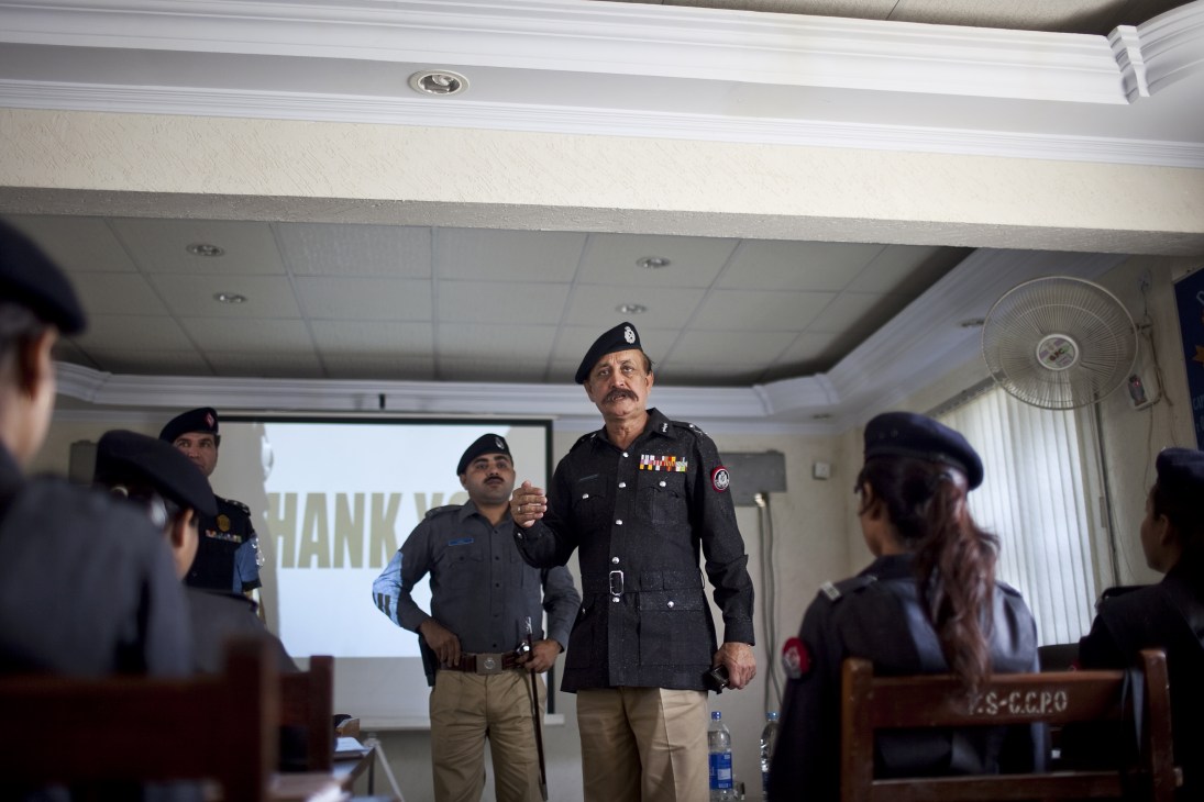 Waseem Ahmed, Karachi's police chief, addresses female police recruits during training.