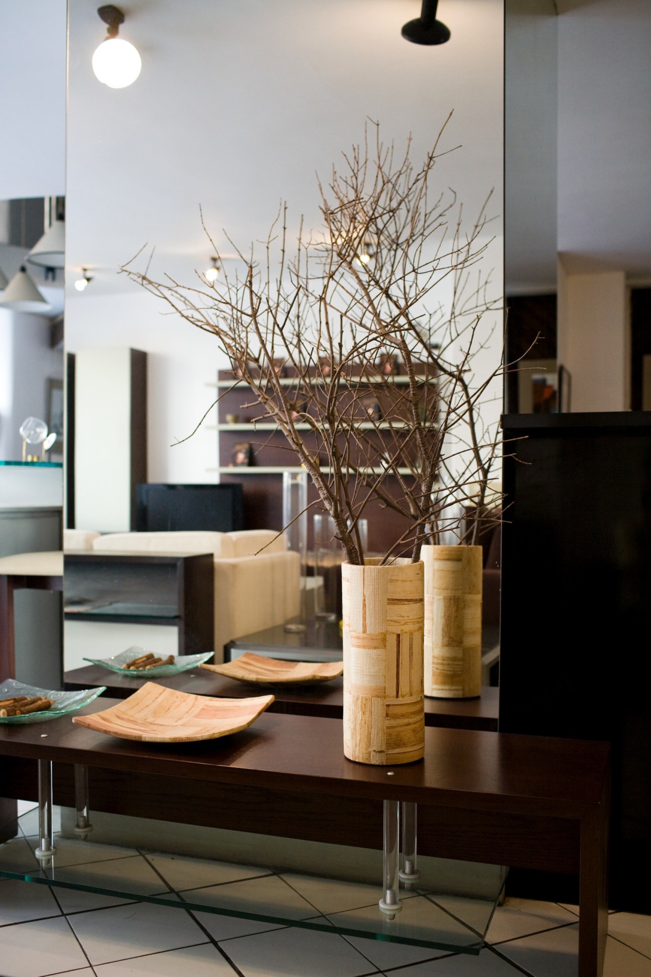 Design Centre Cairo showroom with wooden branch arrangement and minimalist furniture display.