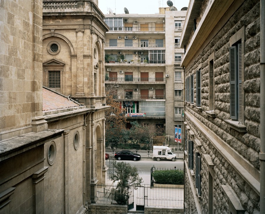 View from St Antoine de Padoue church over the Al-Aziziah quarter showing historic stone buildings and modern apartments