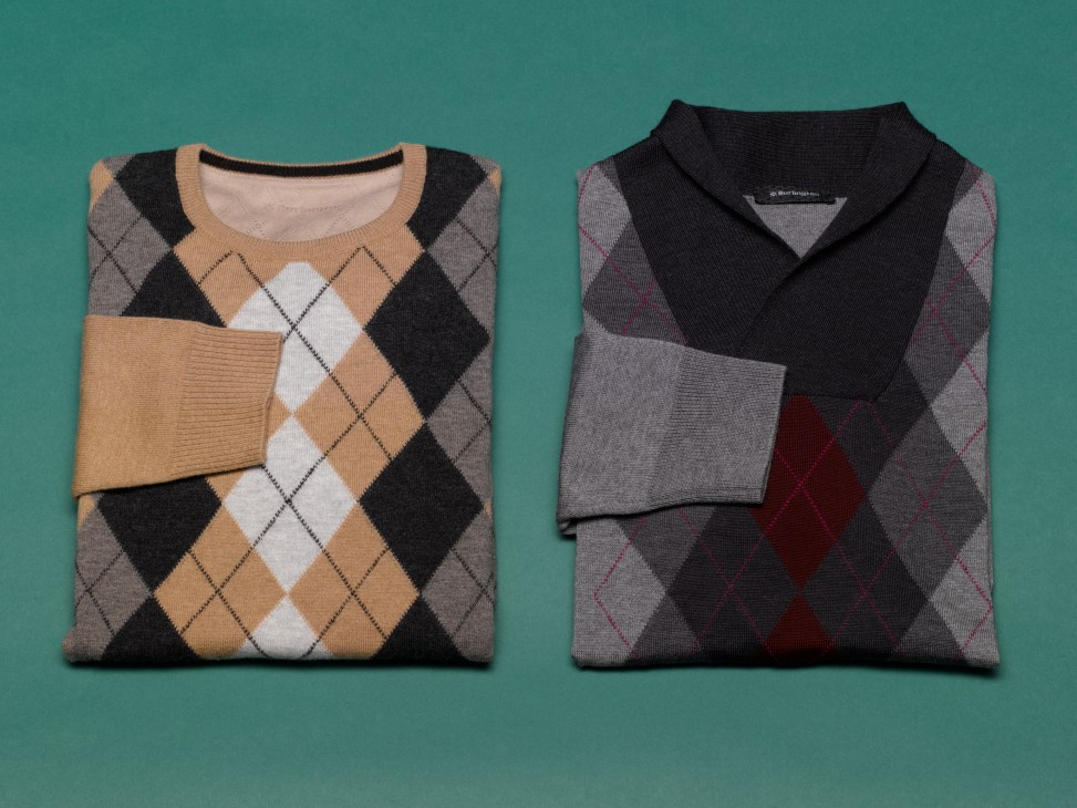 Two folded argyle knit sweaters in neutral tones displayed on a teal background.
