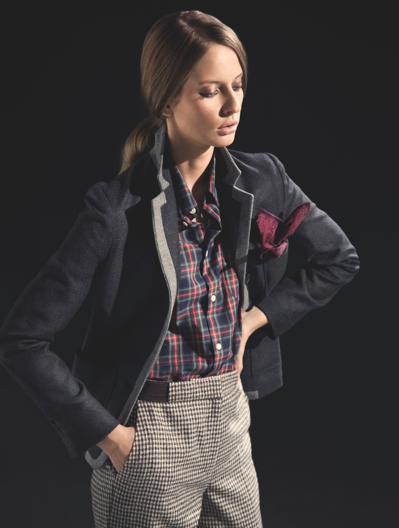Model wearing Barena jacket, A.P.C. shirt and handkerchief, and Incotex trousers against dark background.