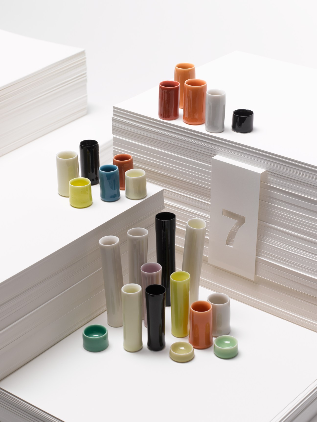 Natasha Daintry ceramic vessels in various colors and sizes arranged on white pages.