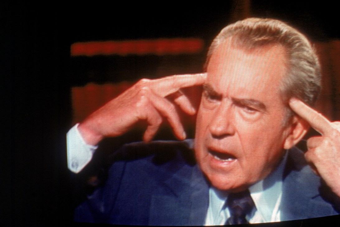 Richard Nixon during an interview with David Frost in 1977, gesturing while speaking.