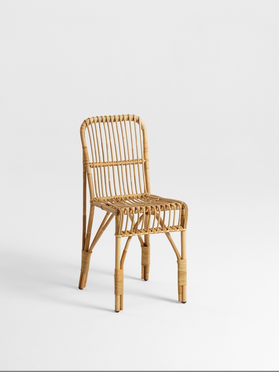 TivoliOne rattan chair by Liggestolen, a light natural woven cane design against a neutral background.