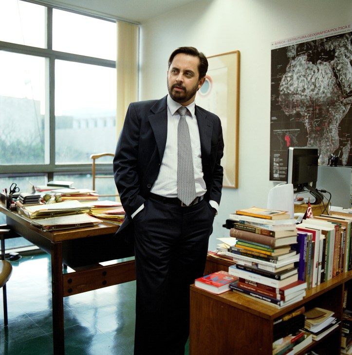 Antonio Augusto Martins Cesar, head of division of Africa I, stands in his office with an Africa map on the wall behind him.