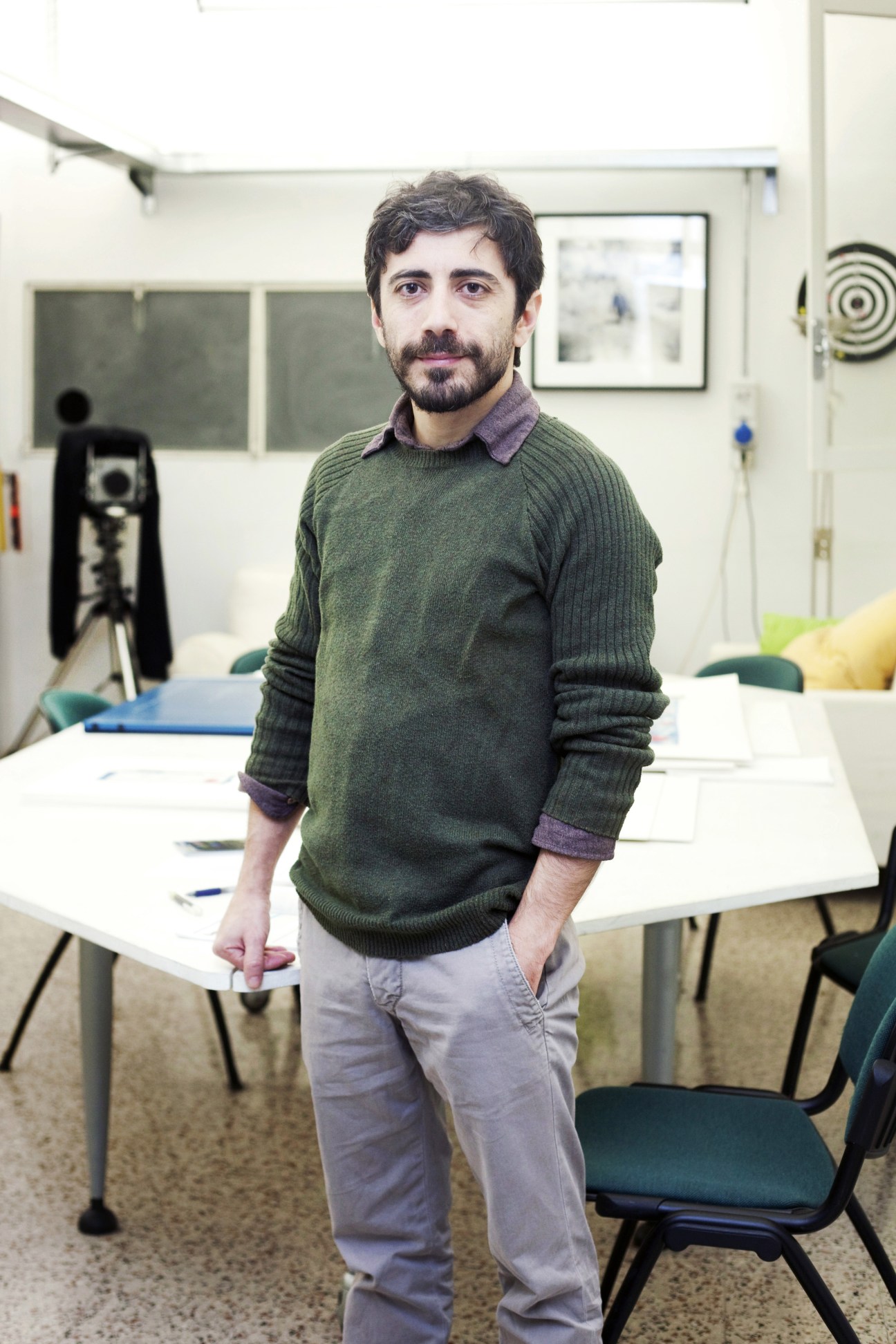 Matteo Alessandri of Camera Oscura photography studio standing in a bright studio workspace.