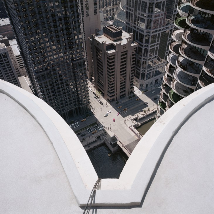 Aerial view of Chicago's Marina City towers and surrounding downtown buildings with Chicago River visible below