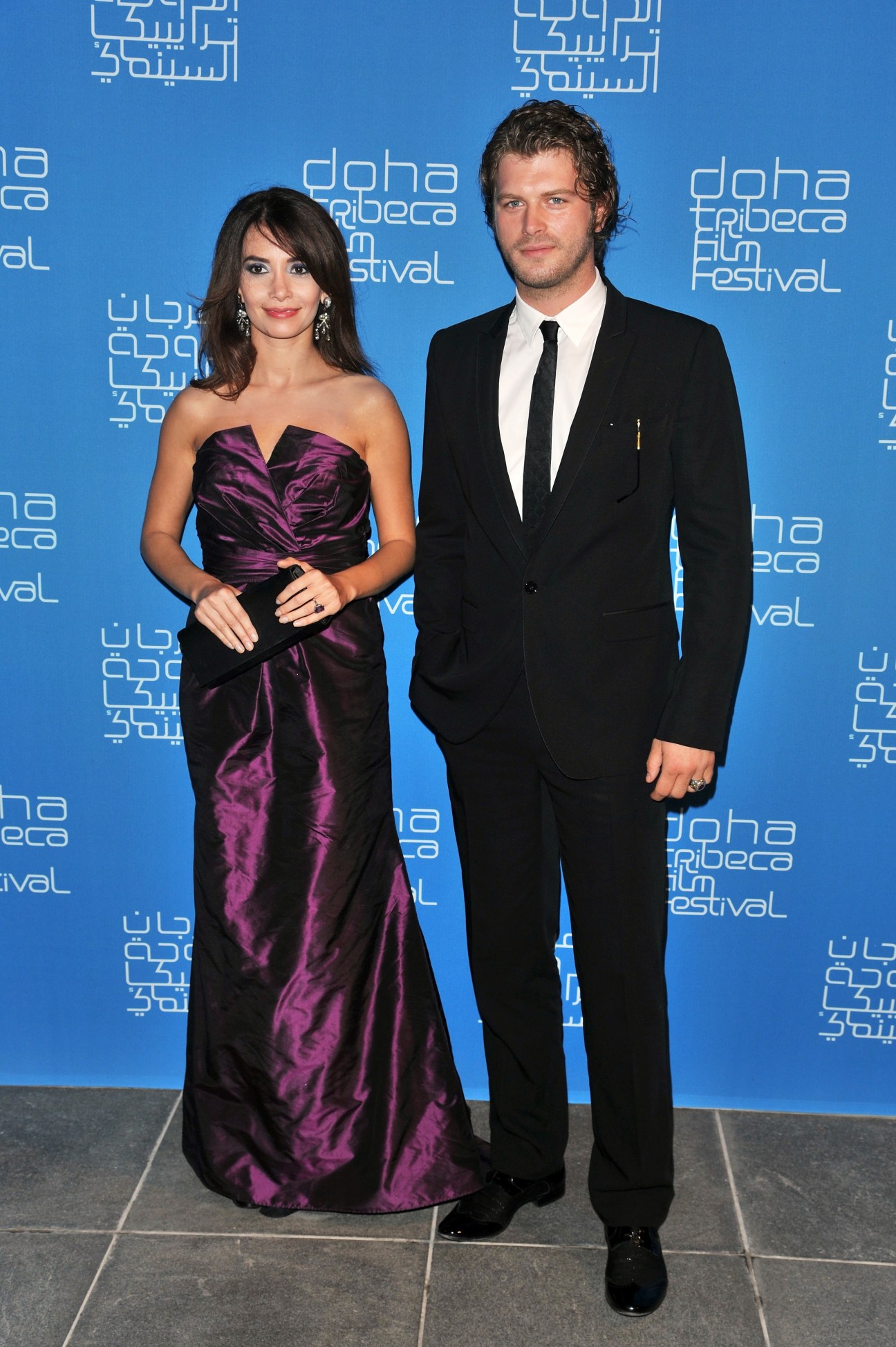 Turkish actor Kivanc Tatlitug at the Doha Tribeca Film Festival in formal attire.